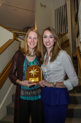 Emily Schimelman (right) accepting the Orion Award from Mystic Seaport Director of Education Sarah Cahill on September 27, 2013.