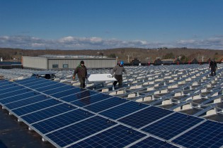 Installation of the solar panels on the roof of the Collections Research Center. Photo taken February 2013.