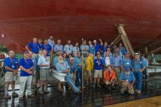 Shipyard Director Quentin Snediker (leaning against the shiplift) and shipwrights who worked on the MORGAN restoration.